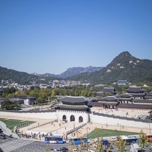 Gyeongbokgung Palace gate in Seoul with traditional hanbok visitors