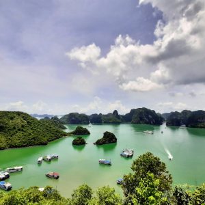 Limestone karsts and junk boats in Ha Long Bay, Vietnam
